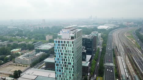 WTC-World-Trade-Center-Amsterdam-zoom-towards-WTC-Building-with-highway-and-railroad-on-the-right