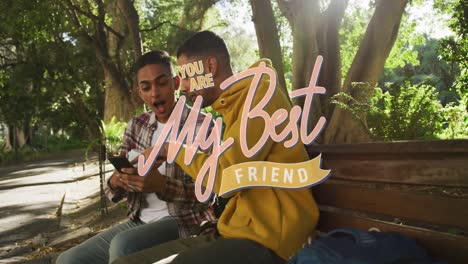 Animation-of-my-best-friend-text-over-happy-biracial-male-friends-using-smartphone