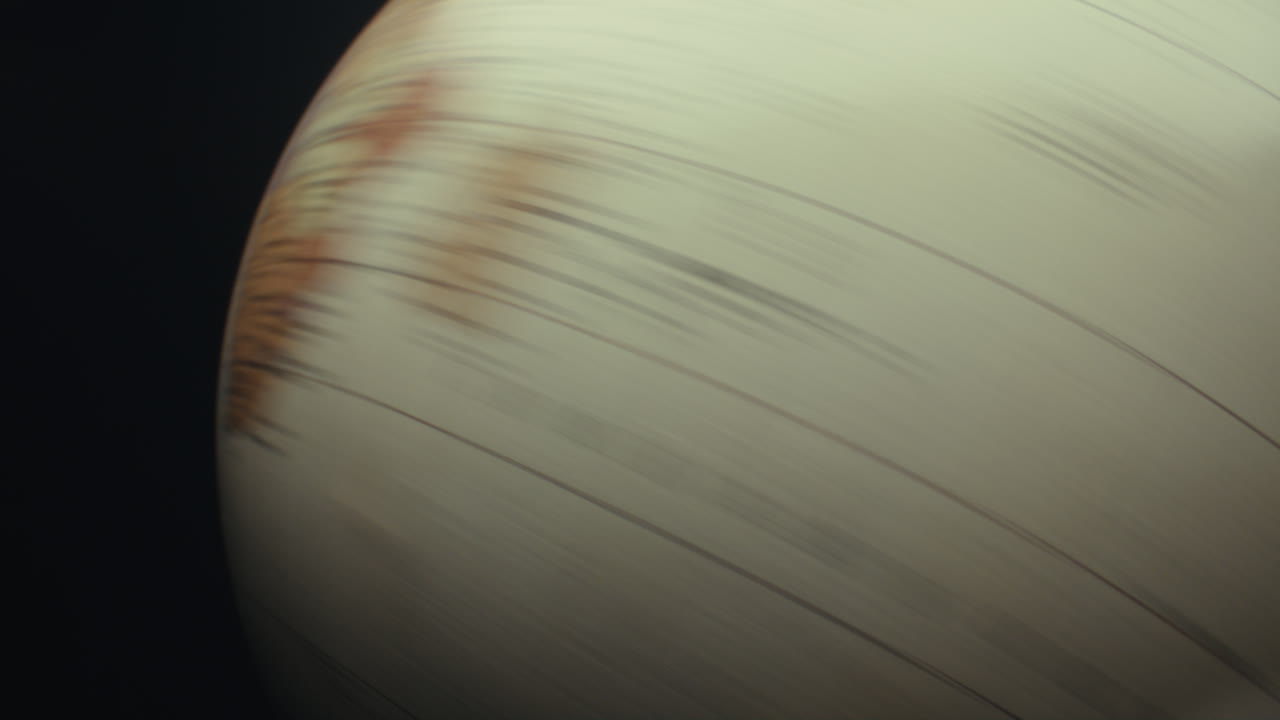 Close-up of a globe and a planet-like object