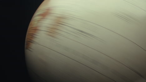 close-up of a globe and a planet-like object
