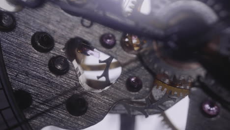 gears spinning a ticking watch - macro shot