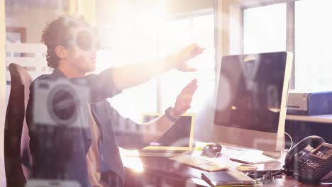 multiple digital icons floating against man using vr headset at office