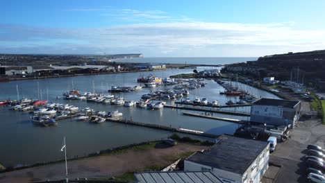 long and slow drone shot flying over marina and port on coast of uk