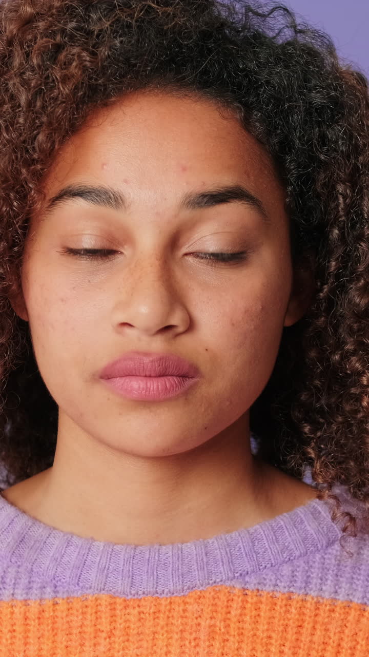Close Up Portrait of Young Woman Opening Eyes and Looking at Camera