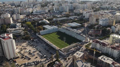 aerial top down view soccer stadium at city centre of portimão - algarve