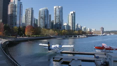 seaplane leaving vancouver harbour flight centre at burrard landing in vancouver, bc, canada