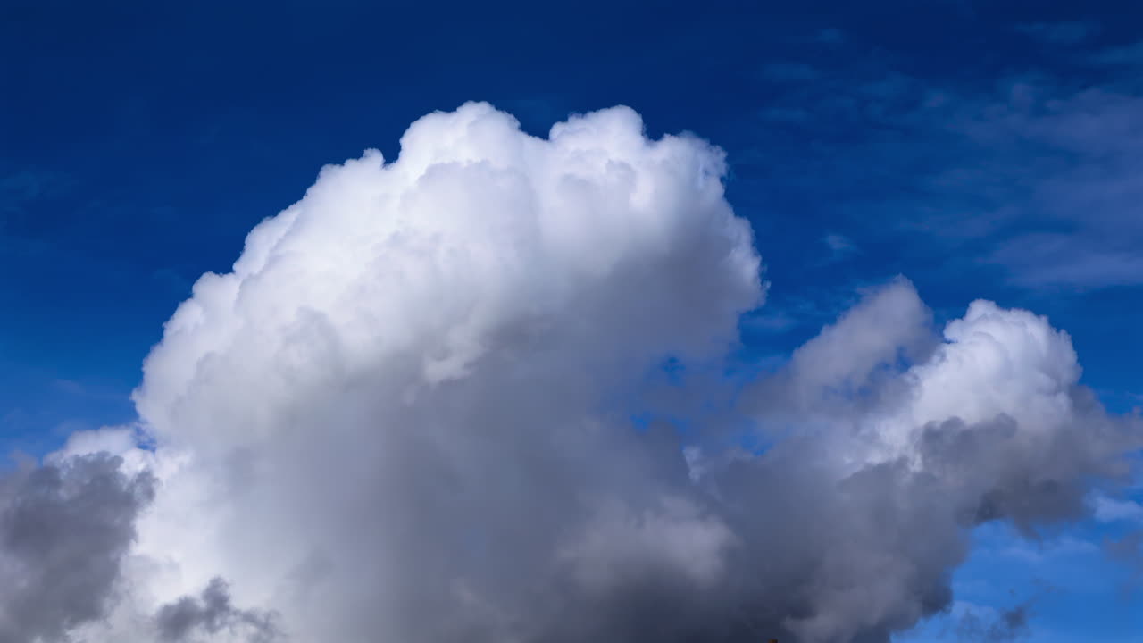 View of white clouds, fluffy moving on the blue sky