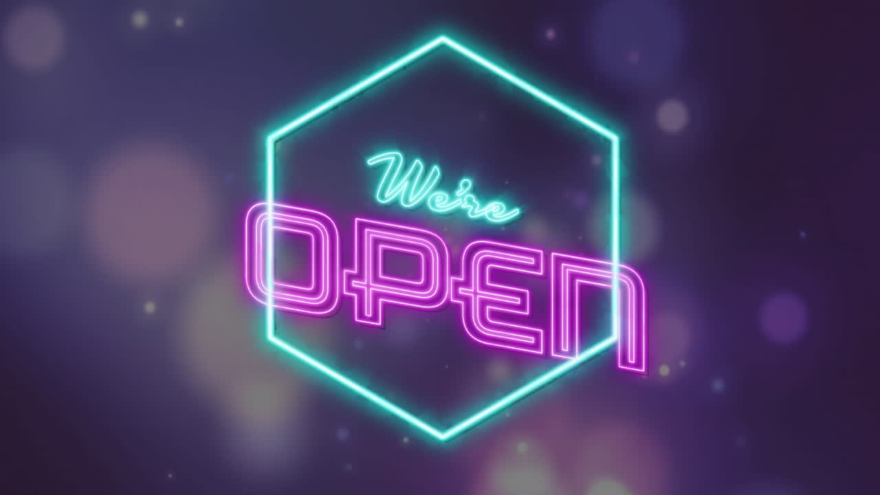 Displaying glowing hexagon, neon sign reading We're Open on dark background