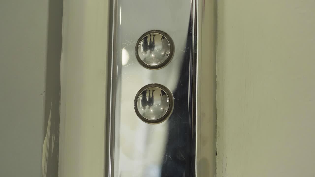 Person Pressing Elevator Button