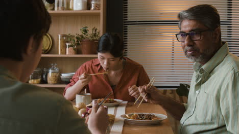 family enjoying a delicious asian dinner together