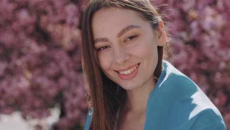 woman smiling outdoors in spring