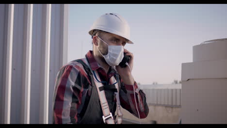 rooftop technician on phone