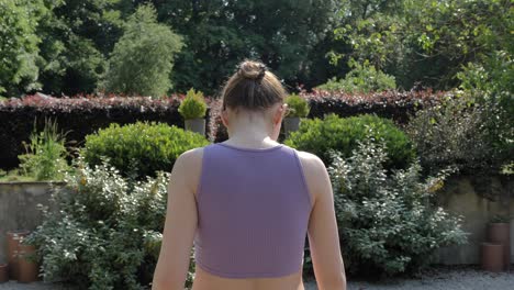 Beautiful-authentic-caucasian-woman-walking-through-garden