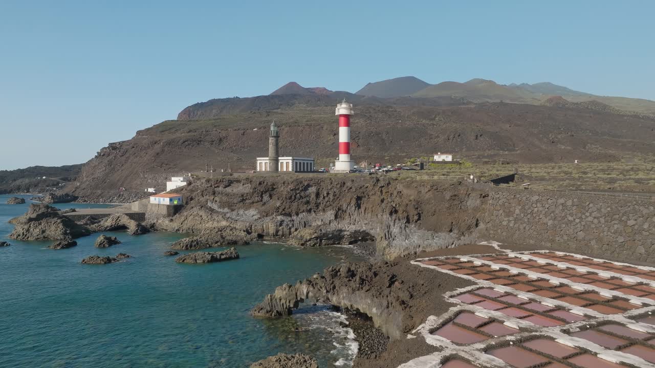 Flying towards Lighthouse Fuencaliente past salt harvesting area on volcanic island