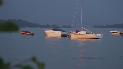 First-darkness-on-the-ravishing-beautiful-Lake-Garda-with-different-boats-in-the-foreground