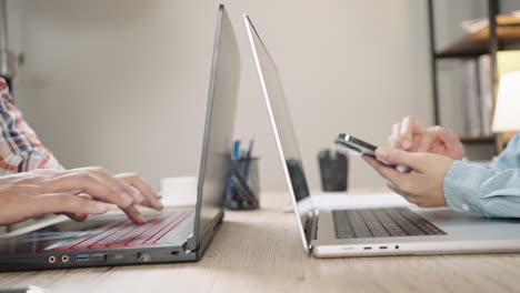 close up shot of businesswoman hands typing on laptop computer keyboard for searching information,online communication support,marketing research,business report in the office desk at night.