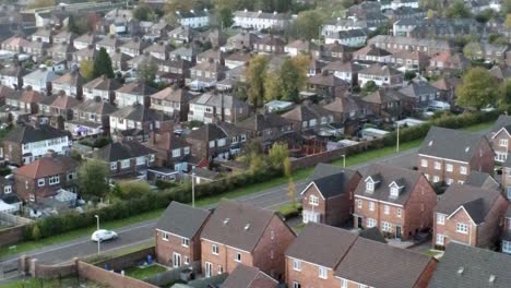 property ladder new british housing estate aerial view overlooking rooftops forward left dolly