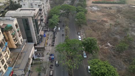 vehicle-pass-on-road-drone-shot