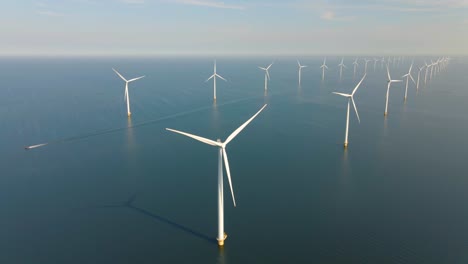 huge windmill turbines, offshore windmill farm in the ocean westermeerwind park , windmills isolated at sea on a beautiful bright day netherlands flevoland noordoostpolder