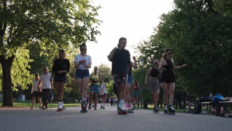 group of women roller skating in a park