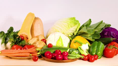 assorted vegetables arranged on a wooden surface