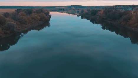 serene river landscape at sunrise/sunset