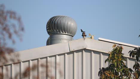 extractor-fan-outside-metal-structure-is-spinning