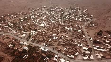 pomegranate garden and historical desert old city map drone aerial view of civilization in iran local people life brown color architecture and concept of eco resort lodge in utah in a hazy day dust