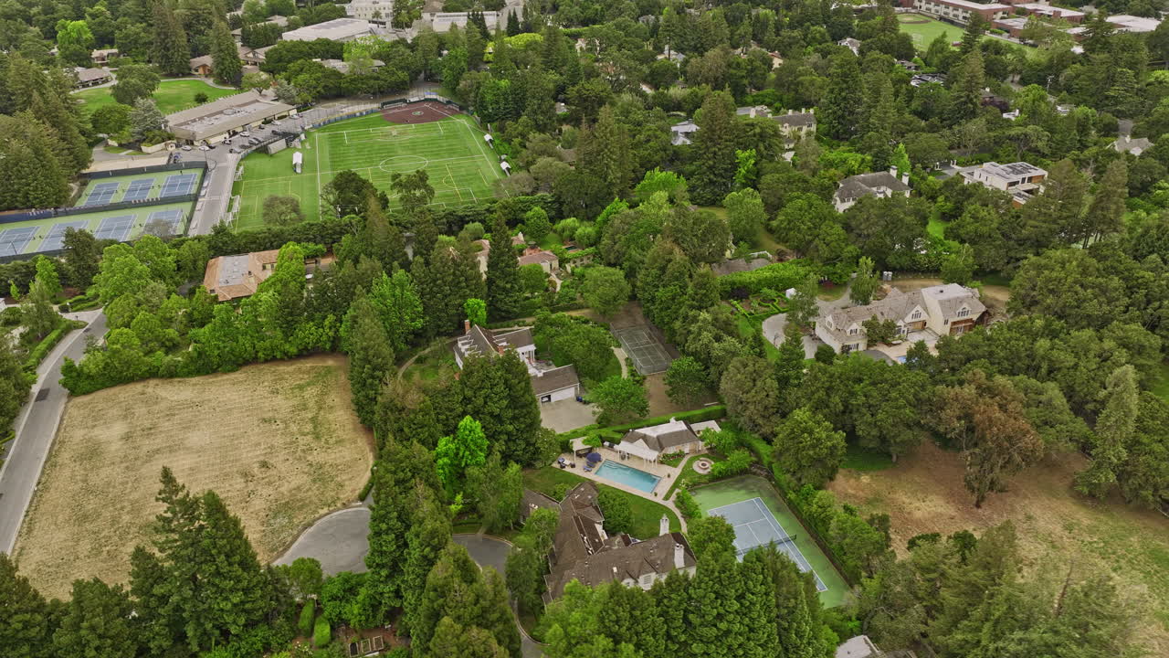 Atherton California Aerial v4 birds eye view flyover wealthy neighborhood capturing private menlo school and upscale residential homes with abundant of green space - Shot with Mavic 3 Cine - June 2022