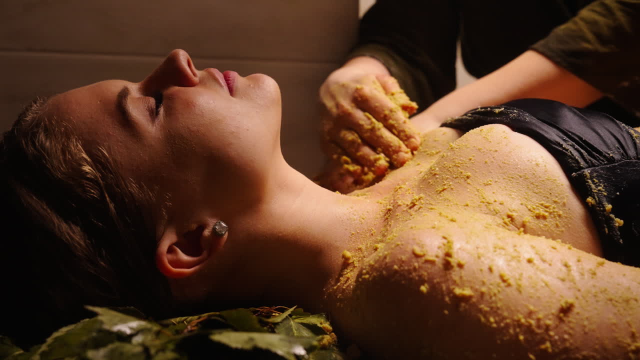 Woman Receiving a Traditional Body Scrub