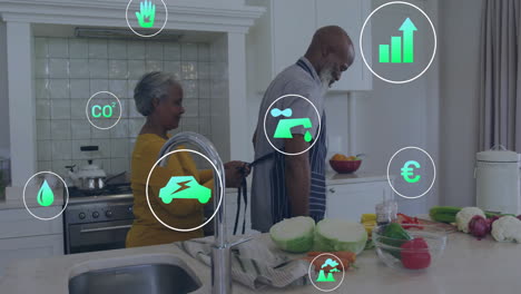 animation of eco icons over senior biracial couple in kitchen