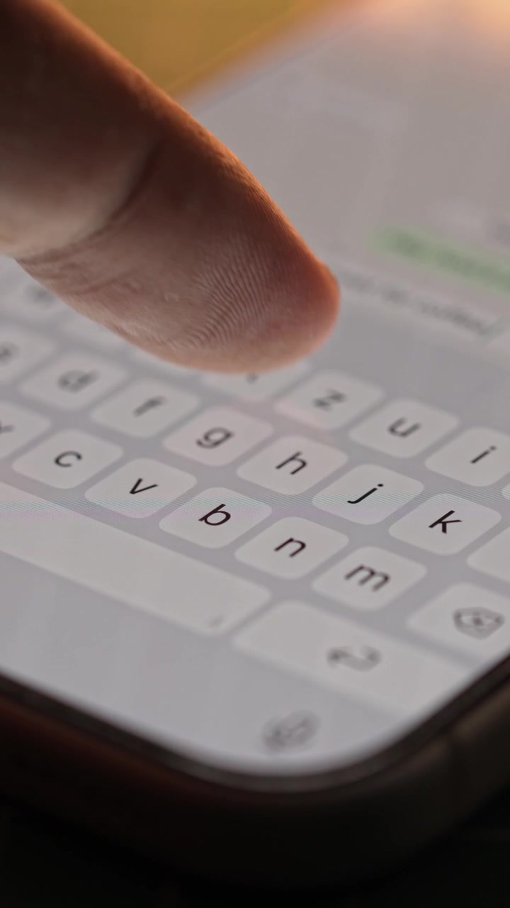 Man hands chatting and typing on smartphone macro closeup. Unrecognizable human typing text message tapping touchscreen keyboard using whatsapp application a social media.