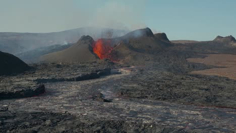 Volcano-erupting-magma-and-lava-river-in-daylight,-Iceland