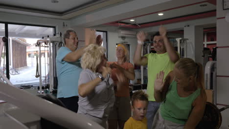 family getting excited after training together in the gym