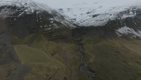 breathtaking scenery of snow-capped iceland mountains and rivers - aerial