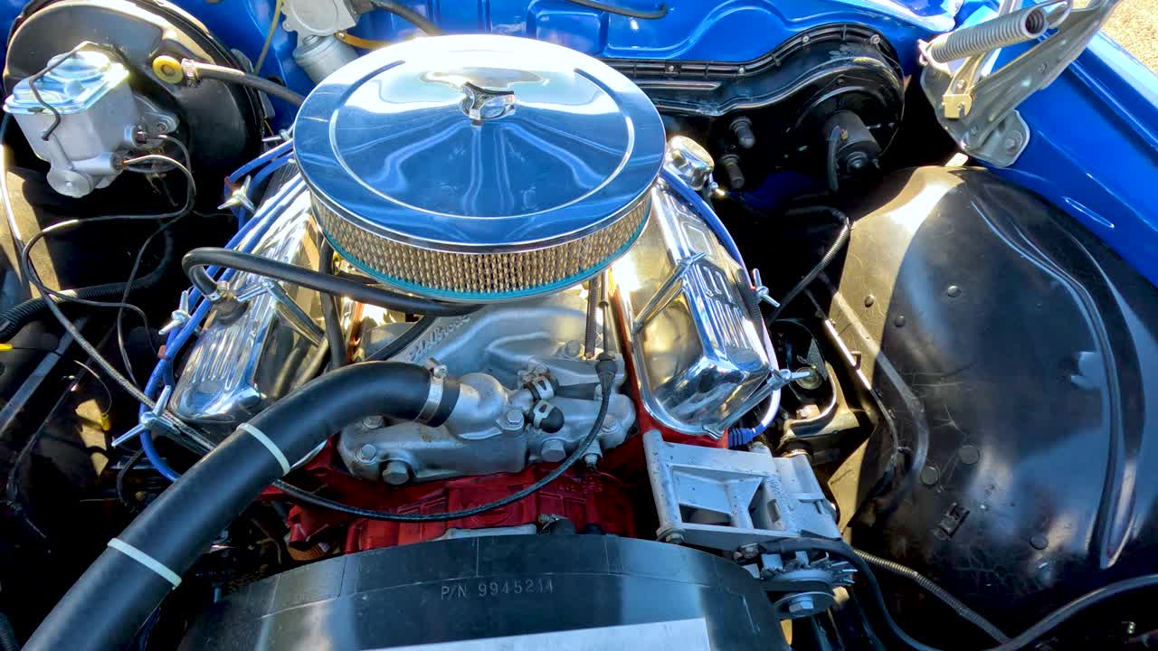 Shiny retro engine showcased at outdoor car festival