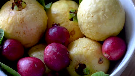 A-bowl-of-fresh-tropical-guava-fruit-rotating,-healthy-eating-concept