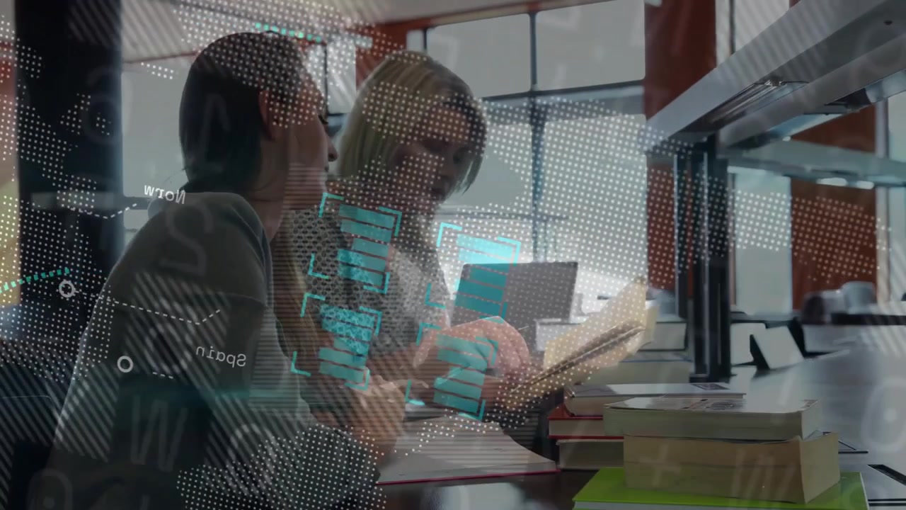 Two Women Collaborating on Research in a Modern Library