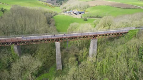 Family cycling over The Ballyvoile Viaduct on The Waterford Greenway on route to Dungarvan