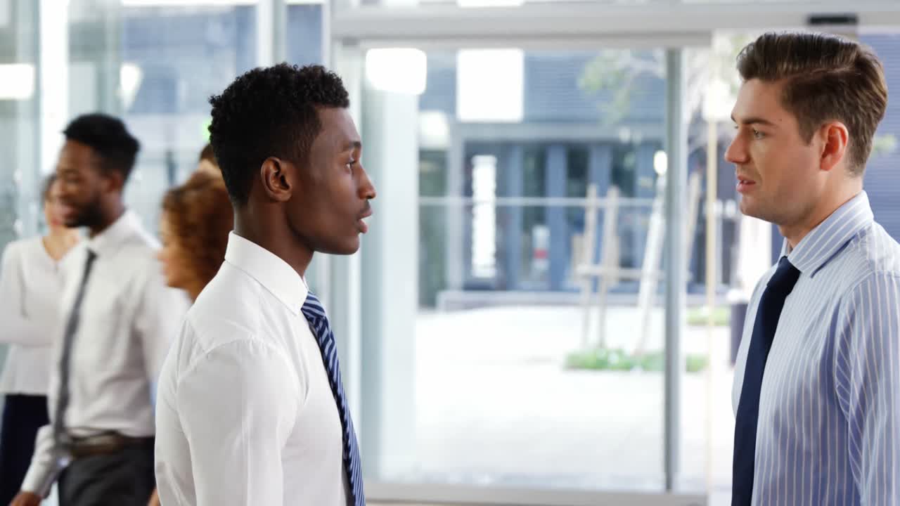 Business executives interacting in office