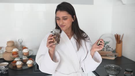 woman enjoying snacks in the kitchen