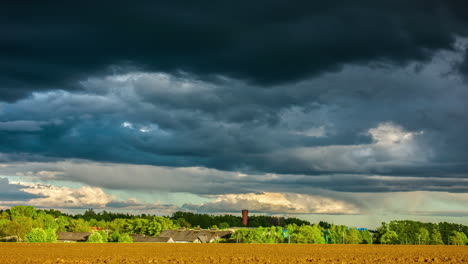 Time-lapse-sky-covered-with-gloomy-clouds-on-rural-green-countryside