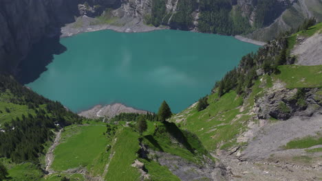 oeschinen lake , above the village of kandersteg in the bernese alps, switzerland