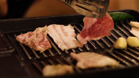 sequence of cooking meat and vegetables on a grill.