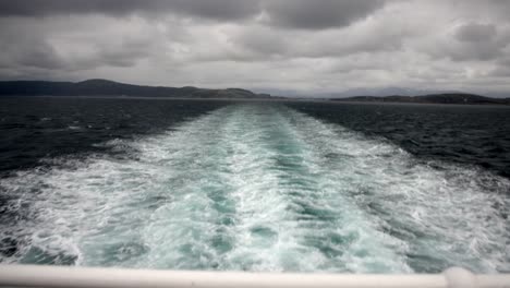 waves behind ferry with bad weather in norway on the way to lofoten