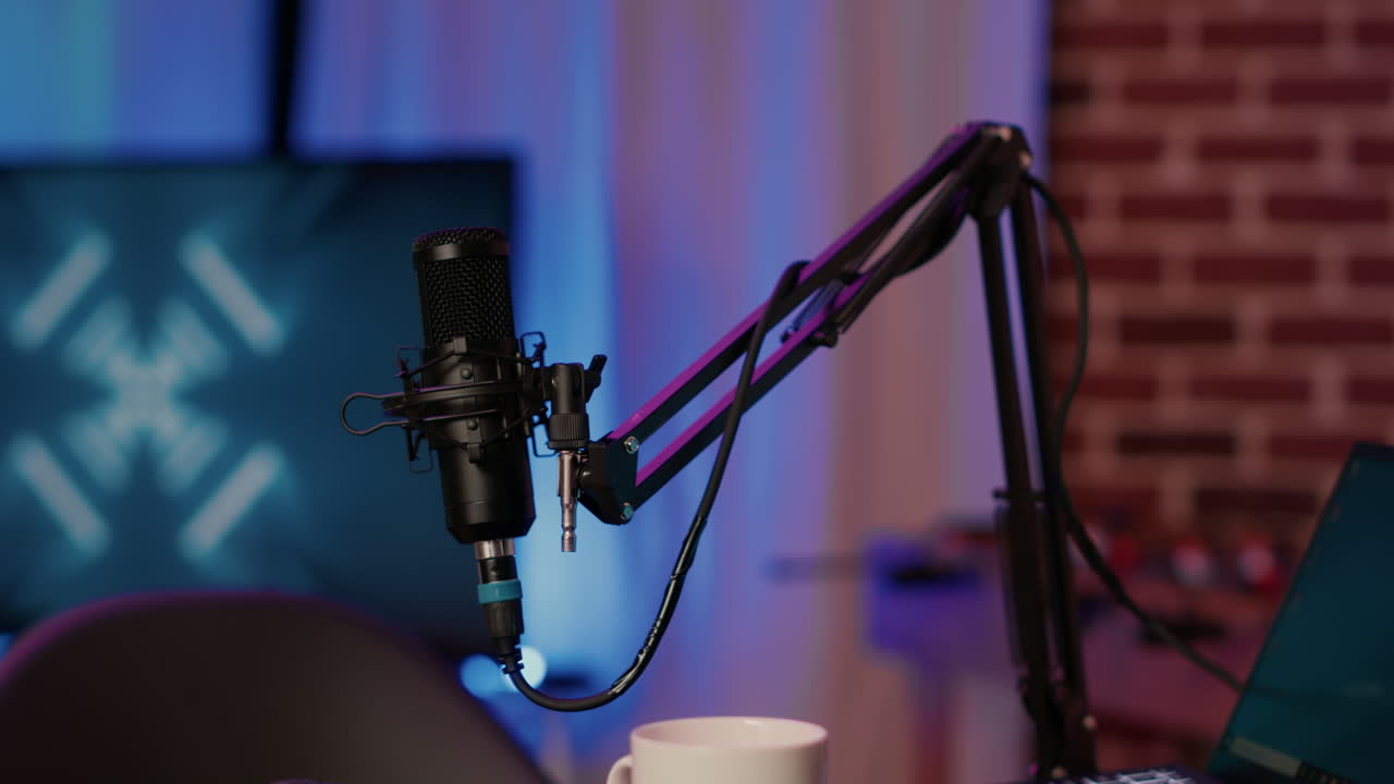 Selective focus on professional boom arm microphone stand used for recording voice in online podcast