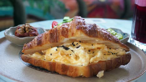 croissant filled with scrambled eggs