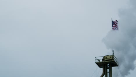 pollution engulfs american flag smoke stack factory