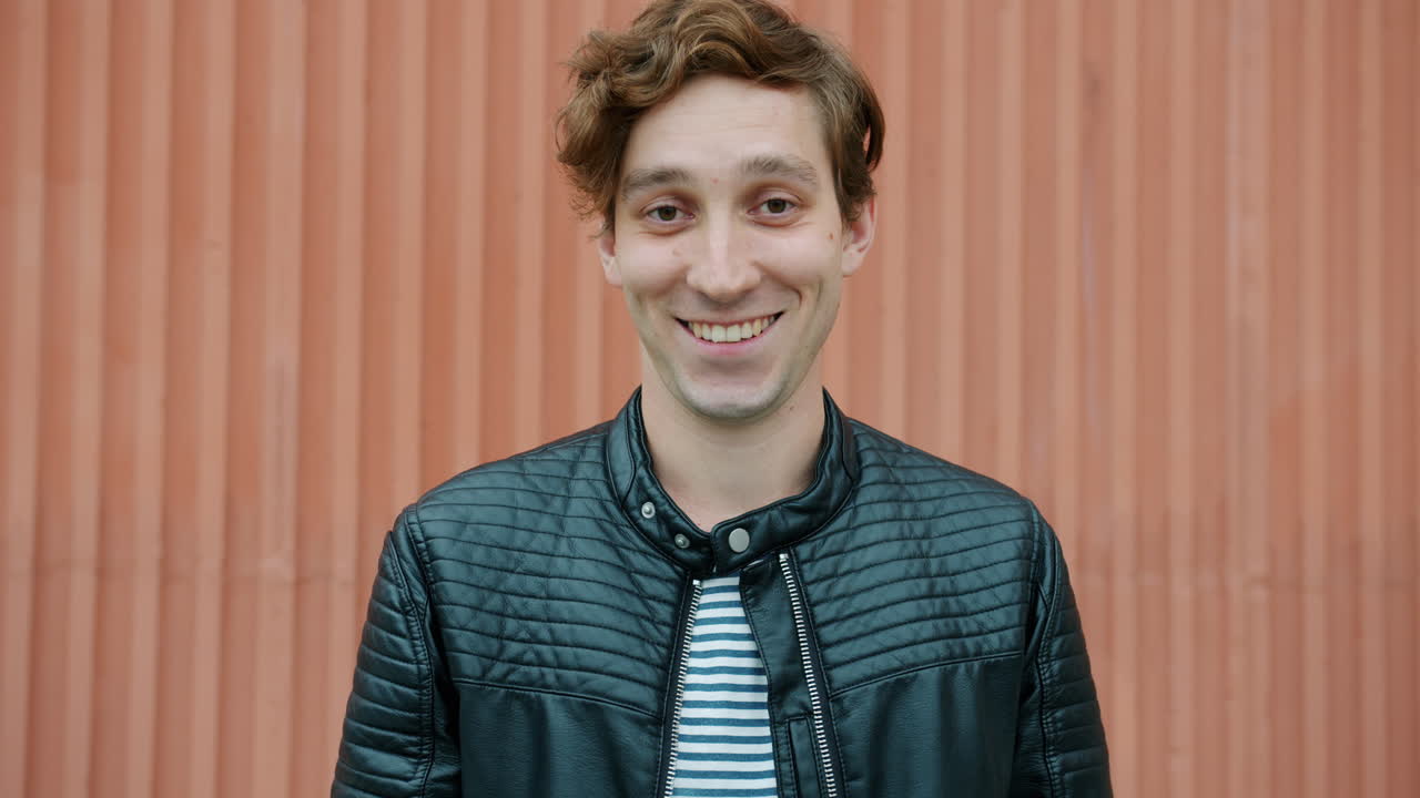Smiling Man in a Leather Jacket