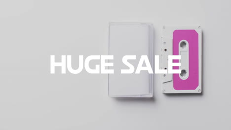 animation of huge sale text over tape on white background
